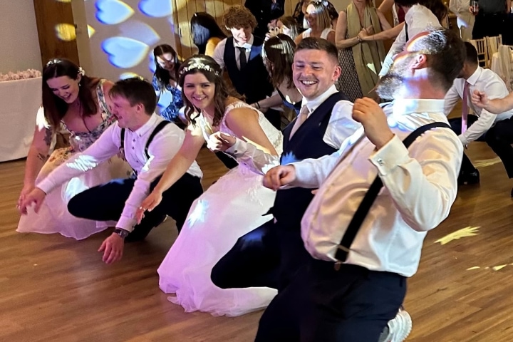 Bride & Groom with wedding guests dancing